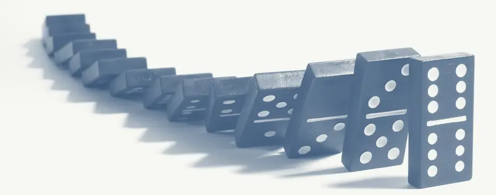 Falling dominoes illustrate cause and effect